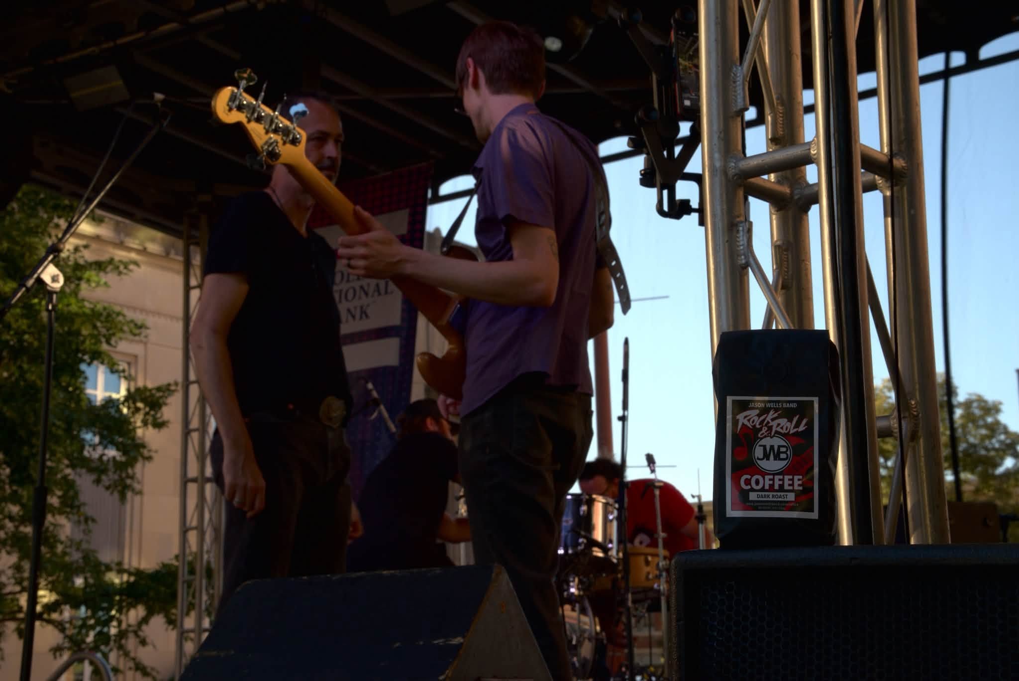 Bandmates playing together on stage